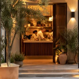 Cozy restaurant entrance and family kitchen counter with warm lighting